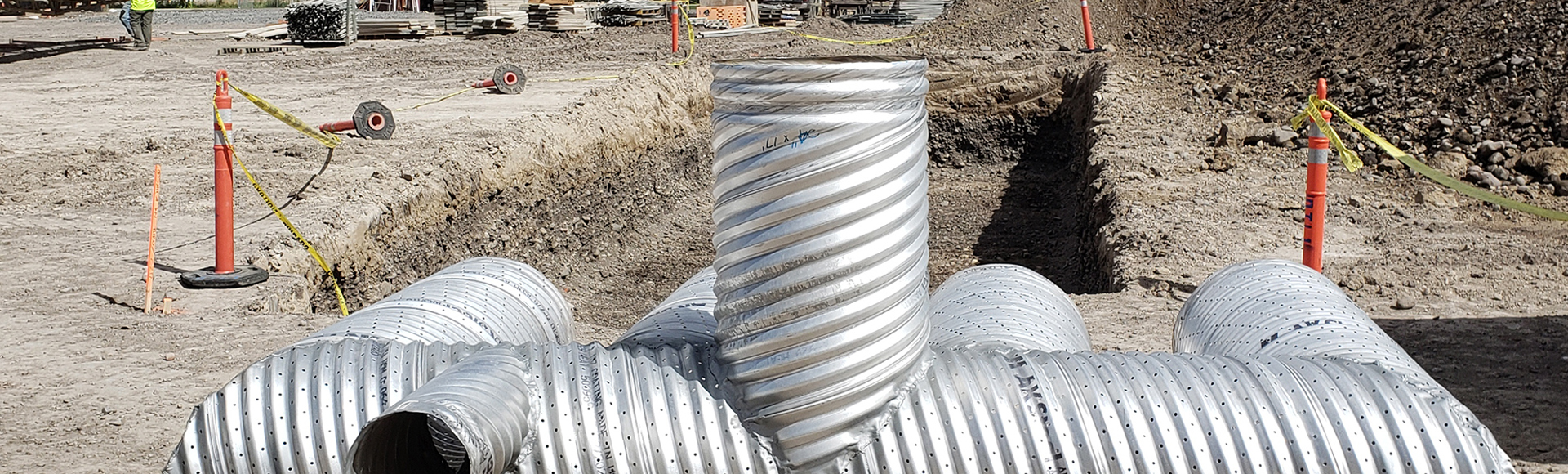 A corrugated metal pipe stormwater detention system under construction. 