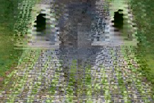 ArmorLoc concrete interlocking block protecting a culvert from erosion. 