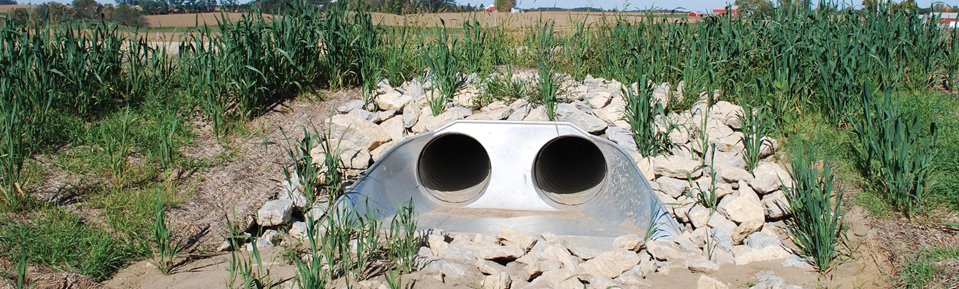 Culvert end section made from corrugated metal pipe. 
