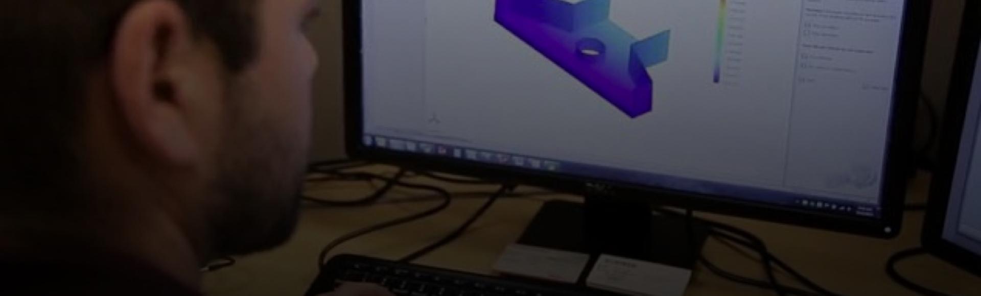 Engineer designing a stormwater treatment system on a computer. 