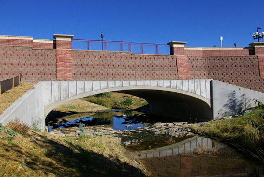 A bridge over a stream made from the CON/SPAN precast modular bridge system.